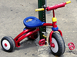 Tricycle locked to sign post Tricycle locked to sign post
